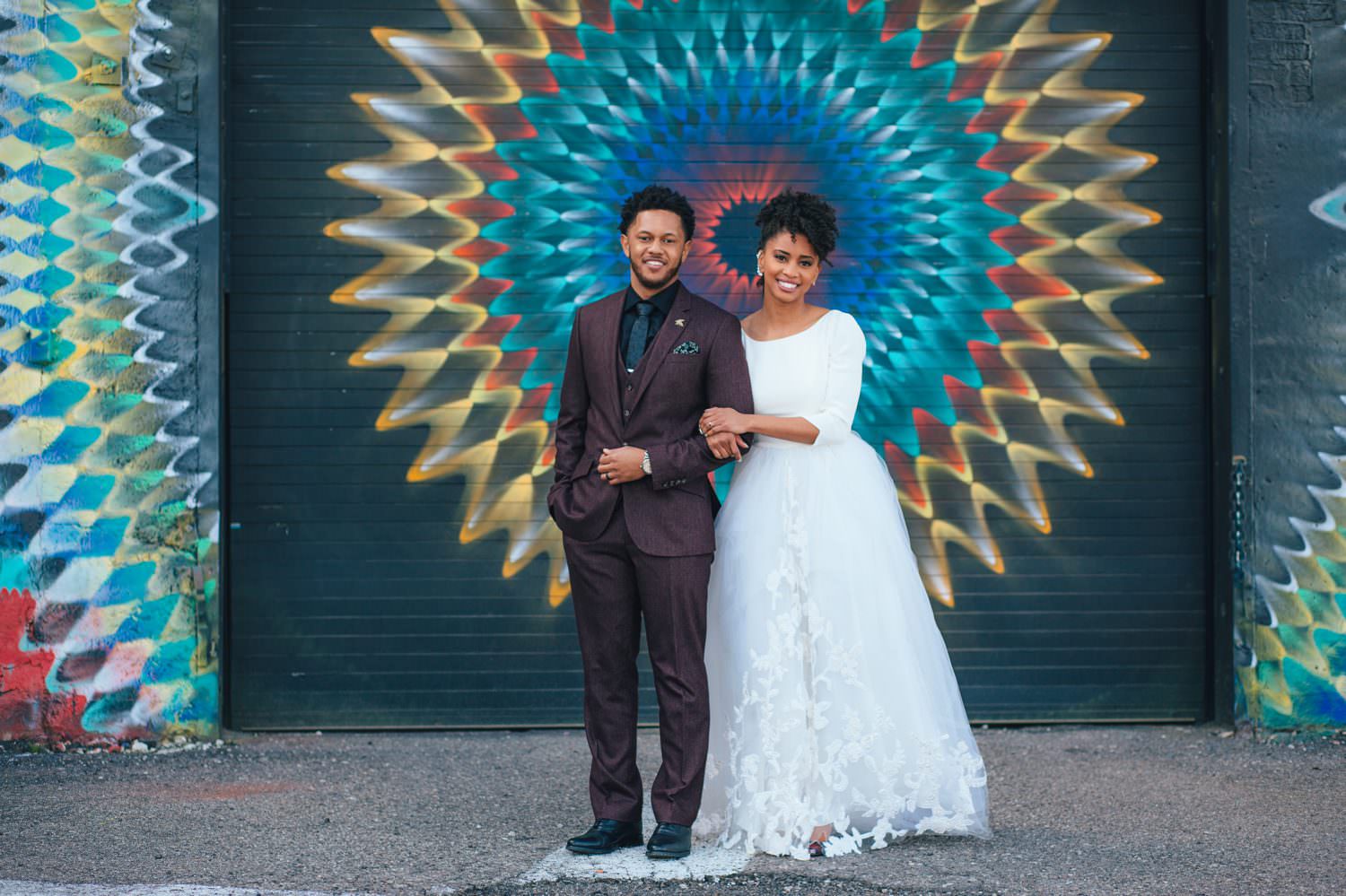 wedding photo in front of Detroit mural