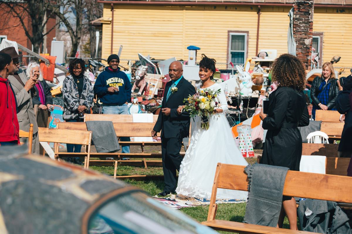 Bride walking down the aisle at the Heidelberg Project