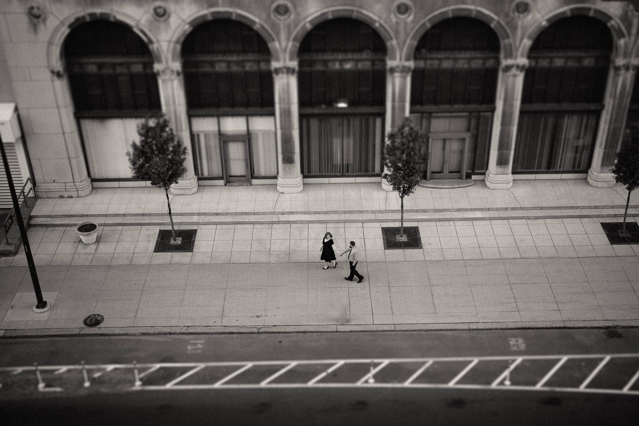 couple holding hands the city street.