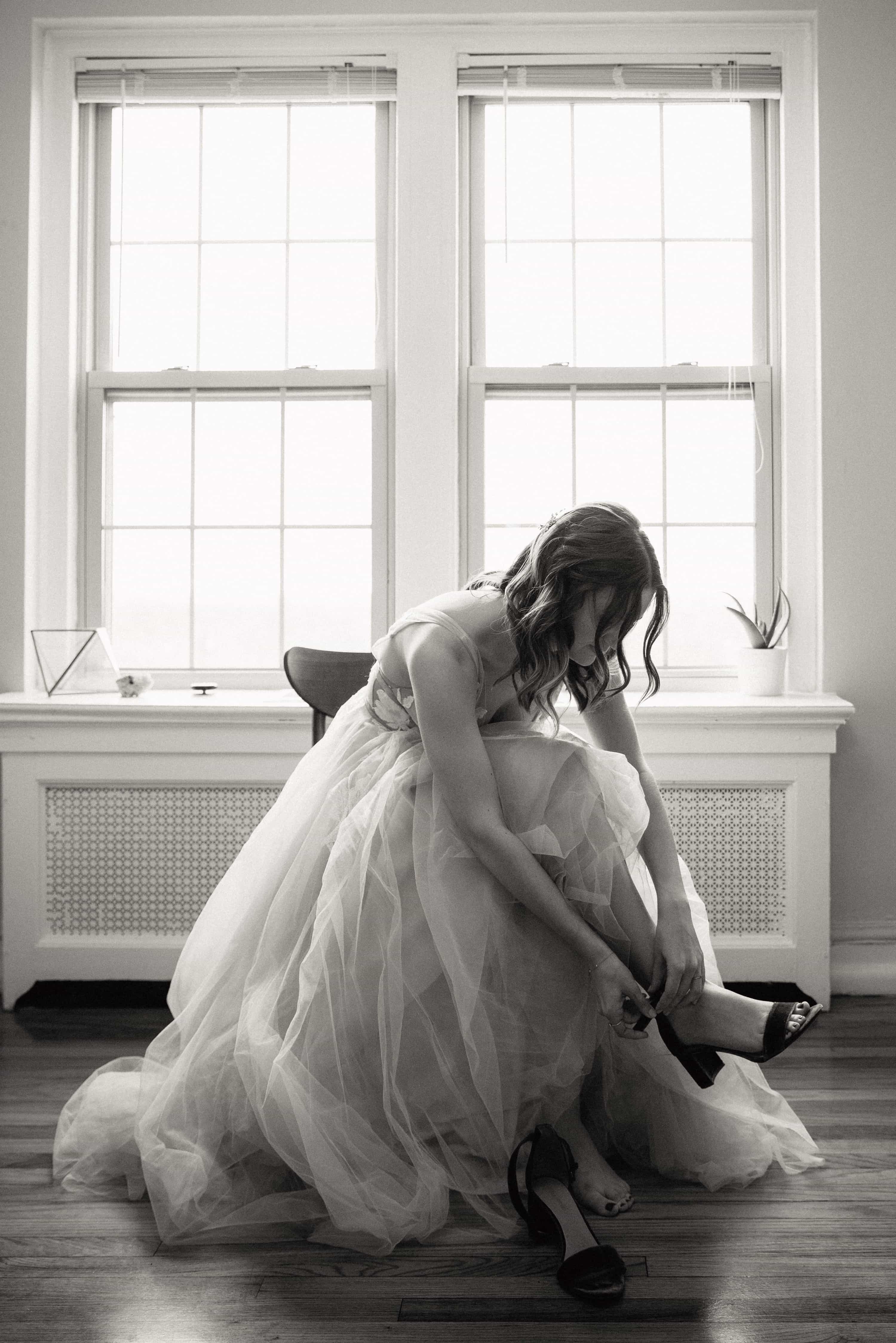 bride putiing on her shoes