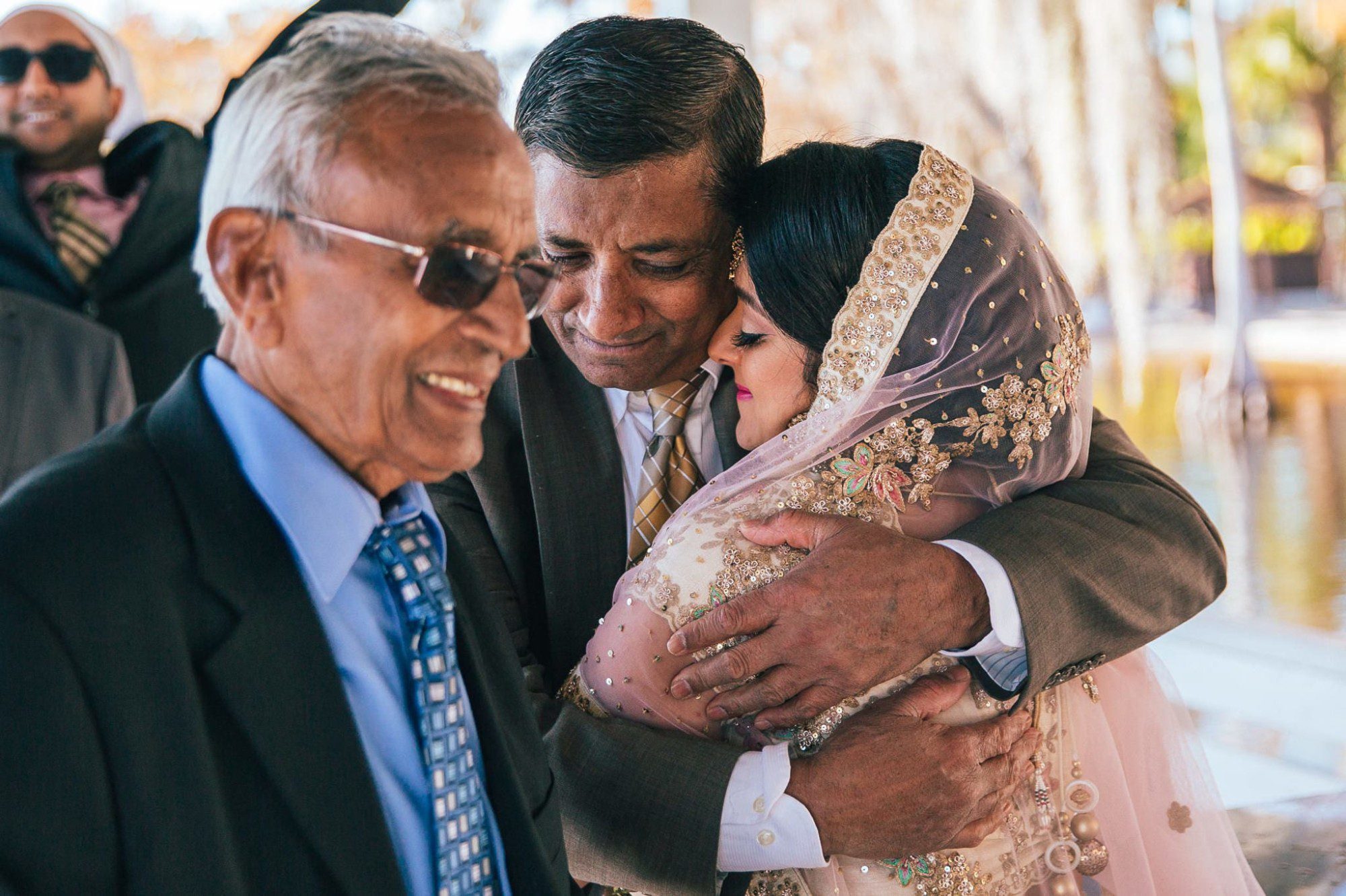 Indian bride hugging uncle