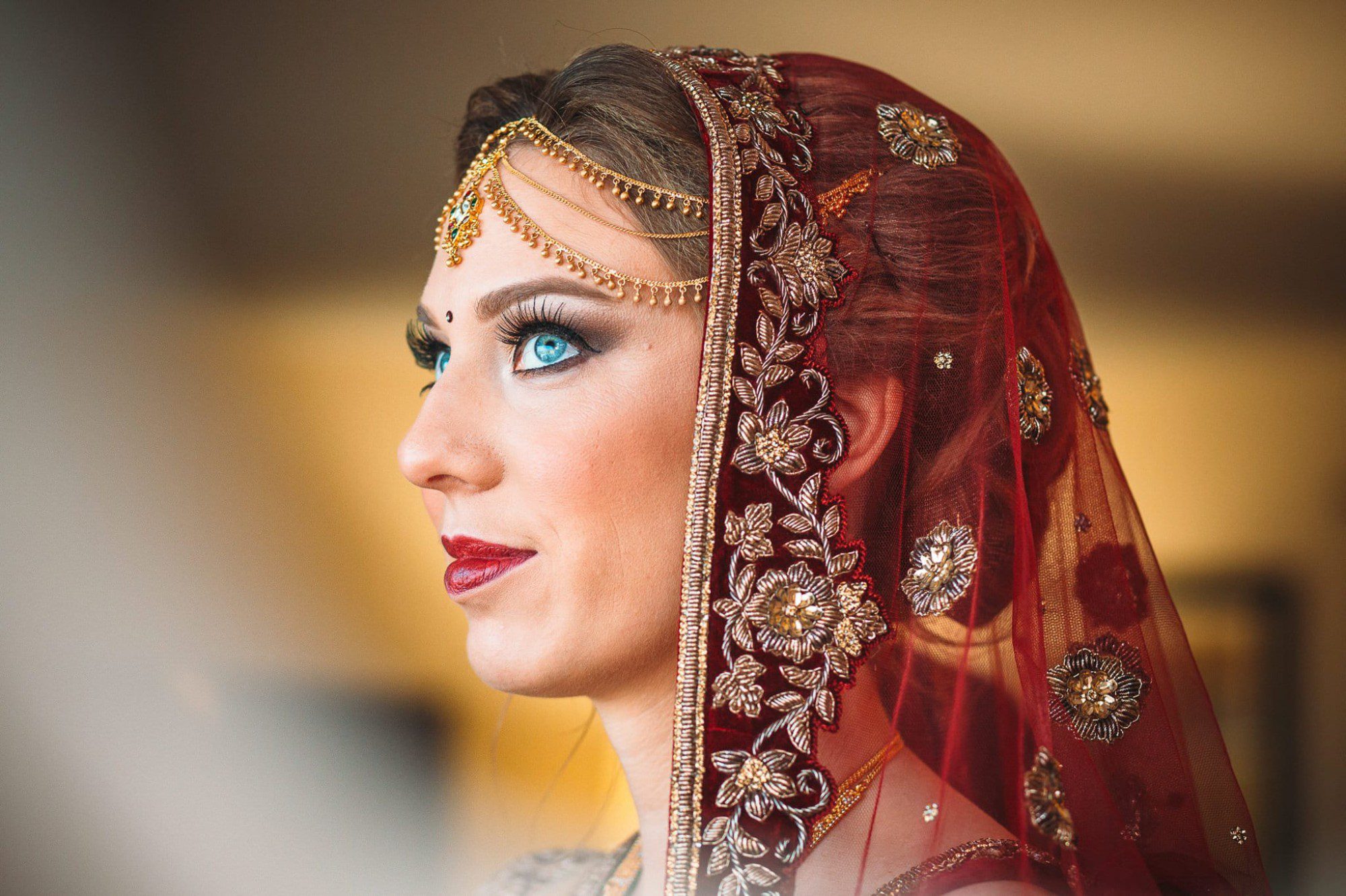 Indian bride looking out the window