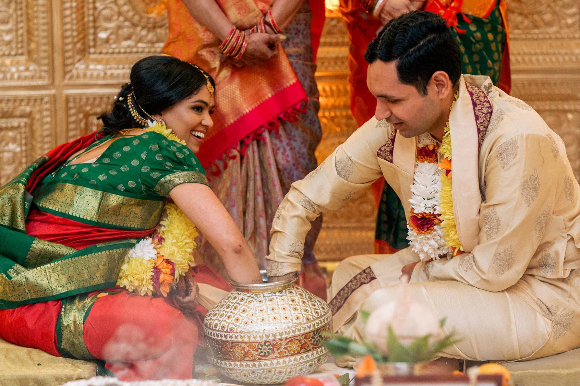 Indian bride and groom playing the ring game