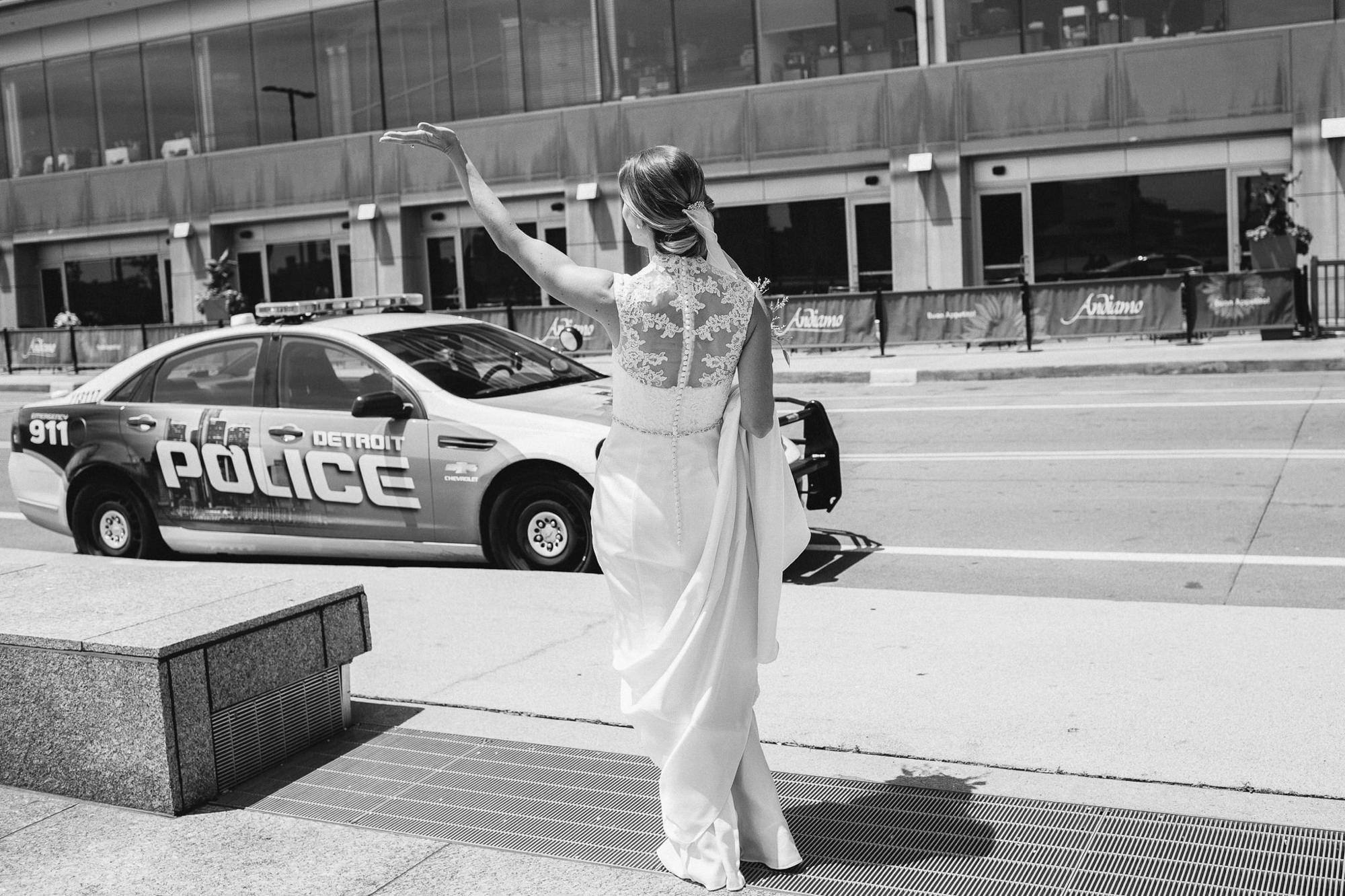 Bride waving to Detroit police