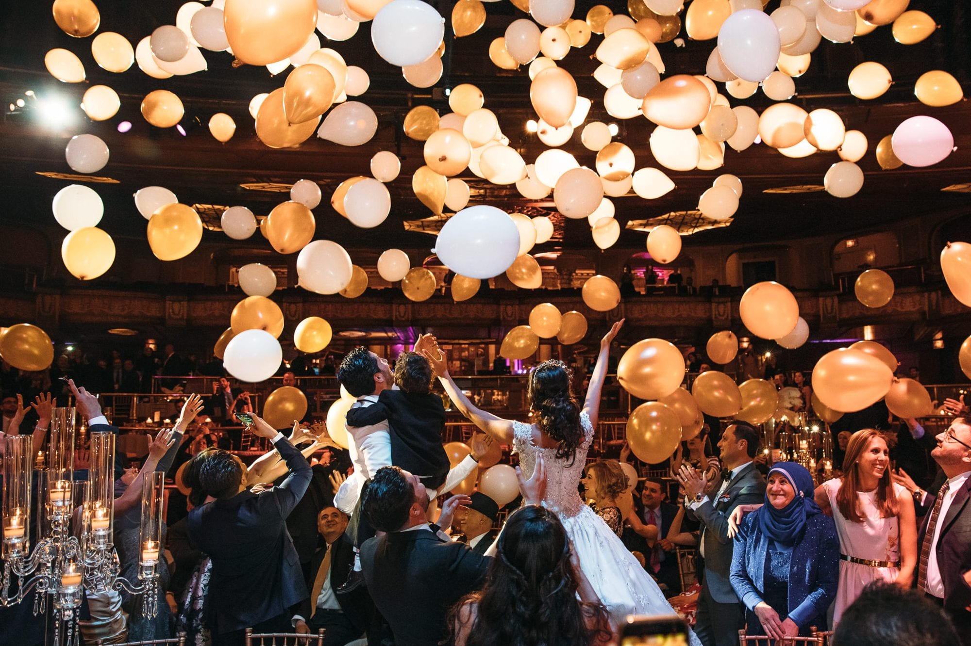balloons falling from the ceiling during wedding reception