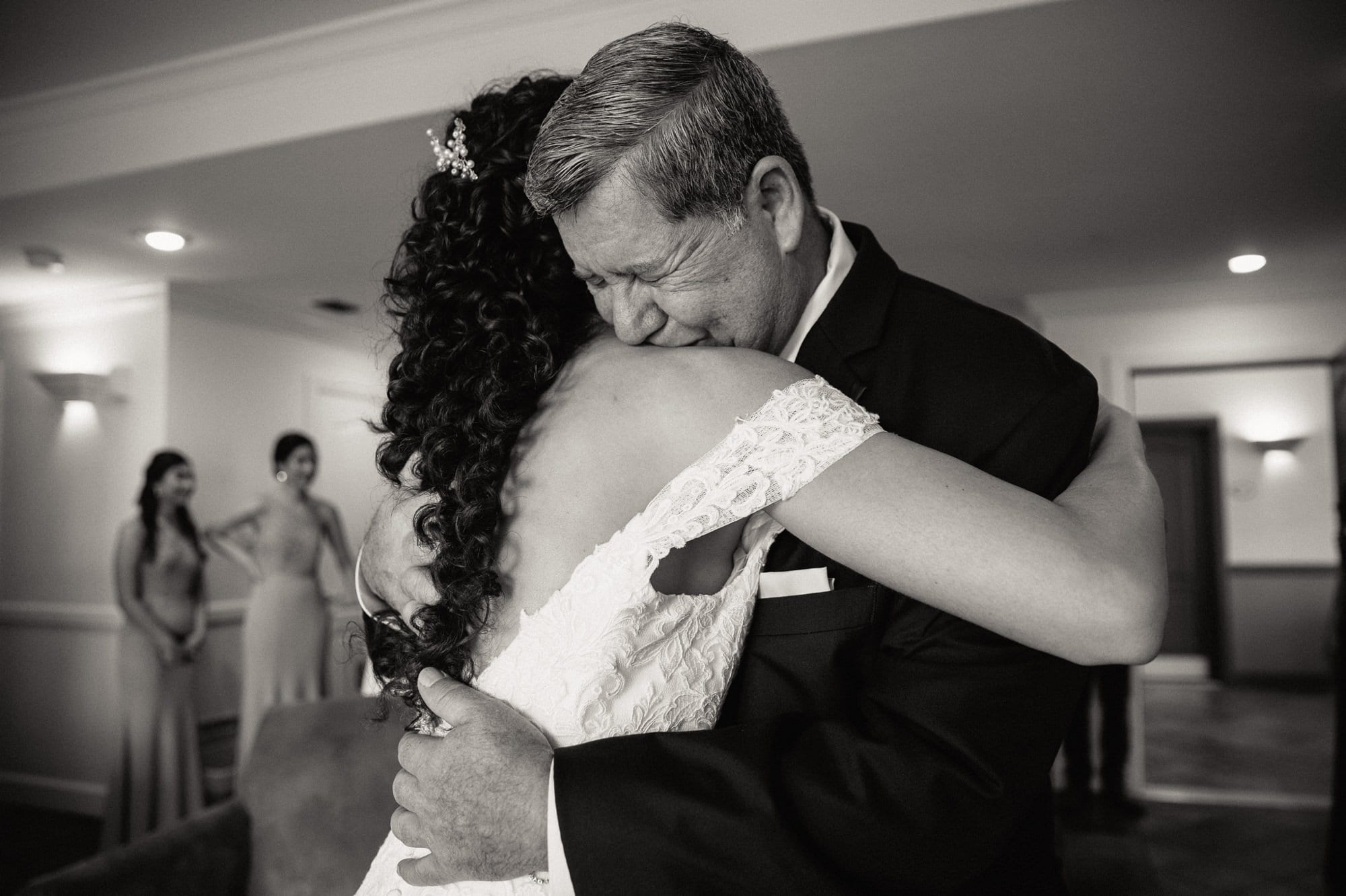 bride and her father hugging during first look