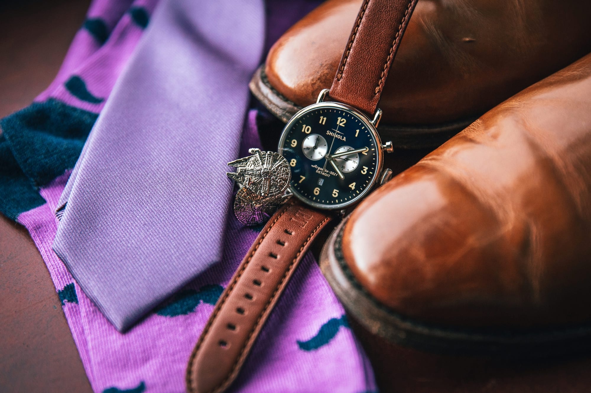 A photo of the groom's Shinola watch and Star Wars cufflinks
