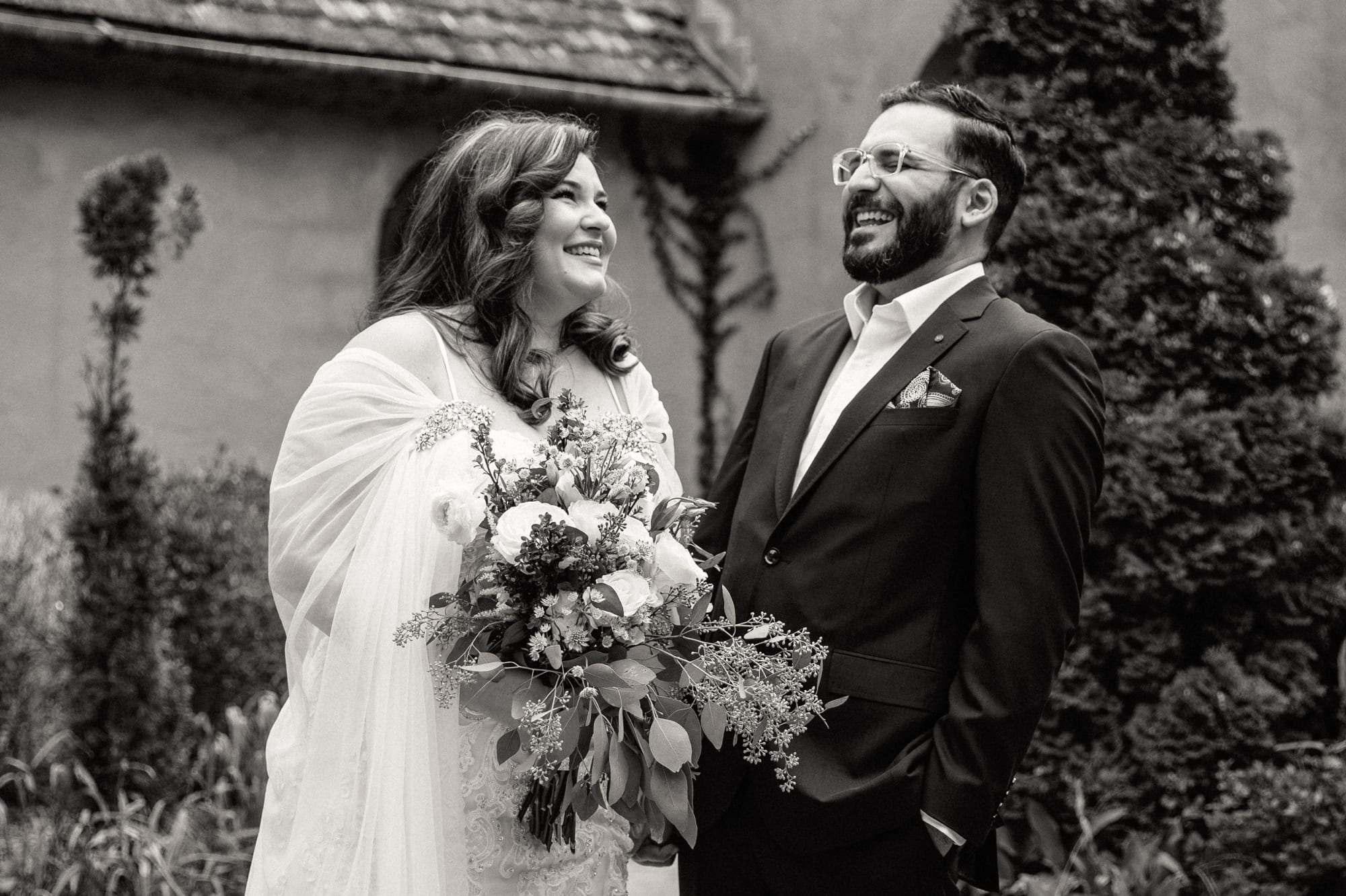 bride and groom laughing during first look