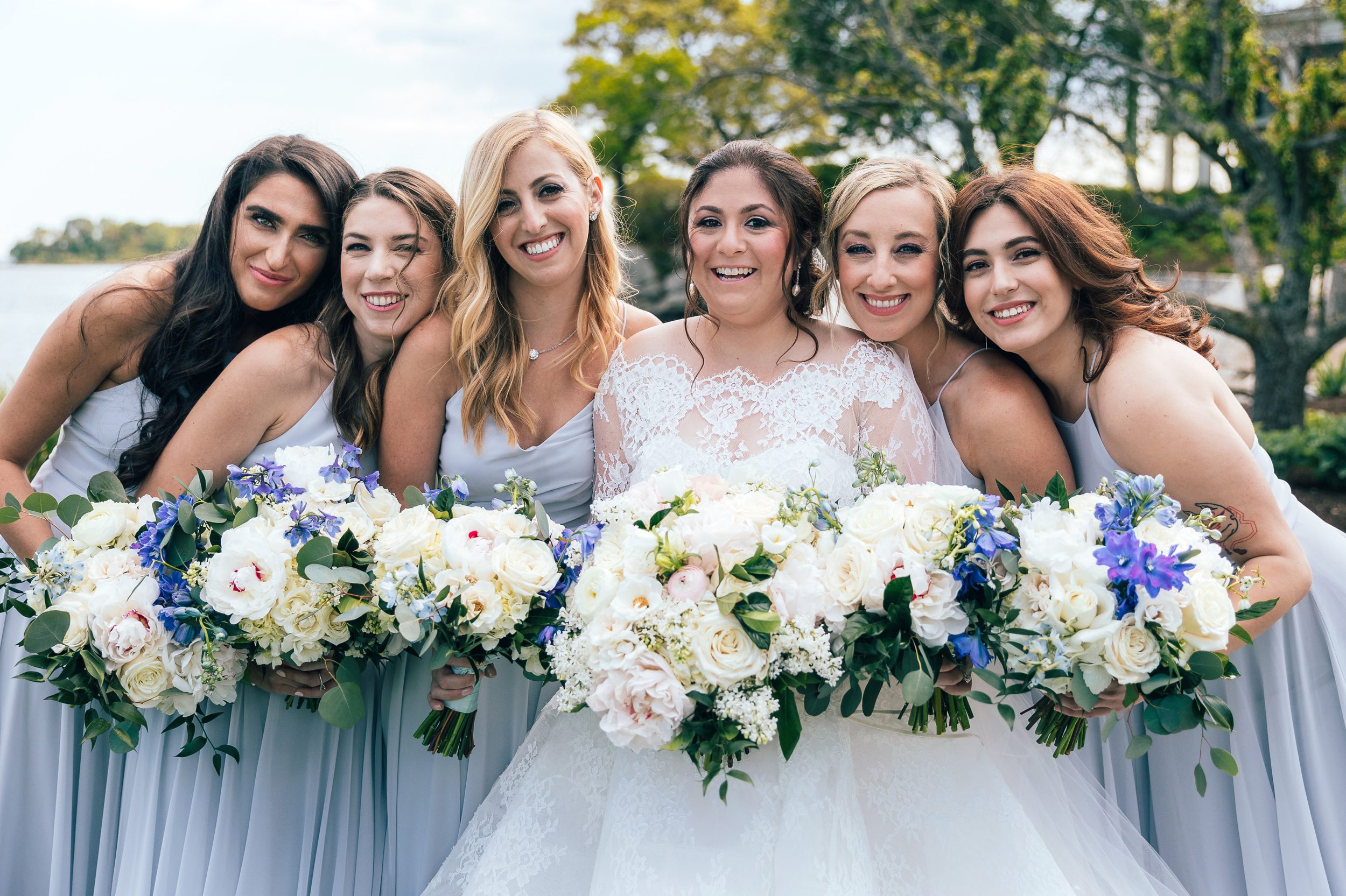 bridemaids laughing with bride