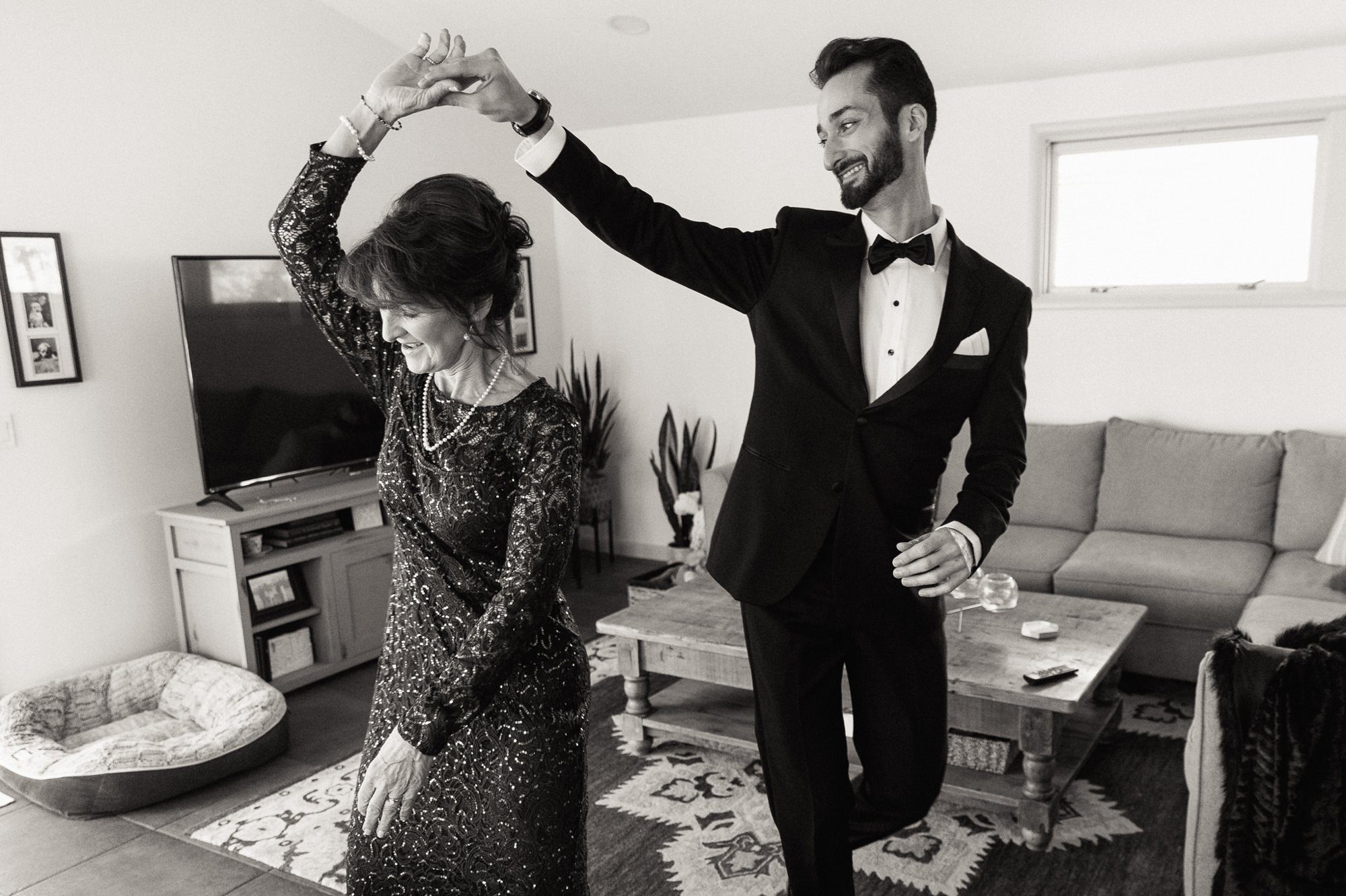 groom and mother dancing in house