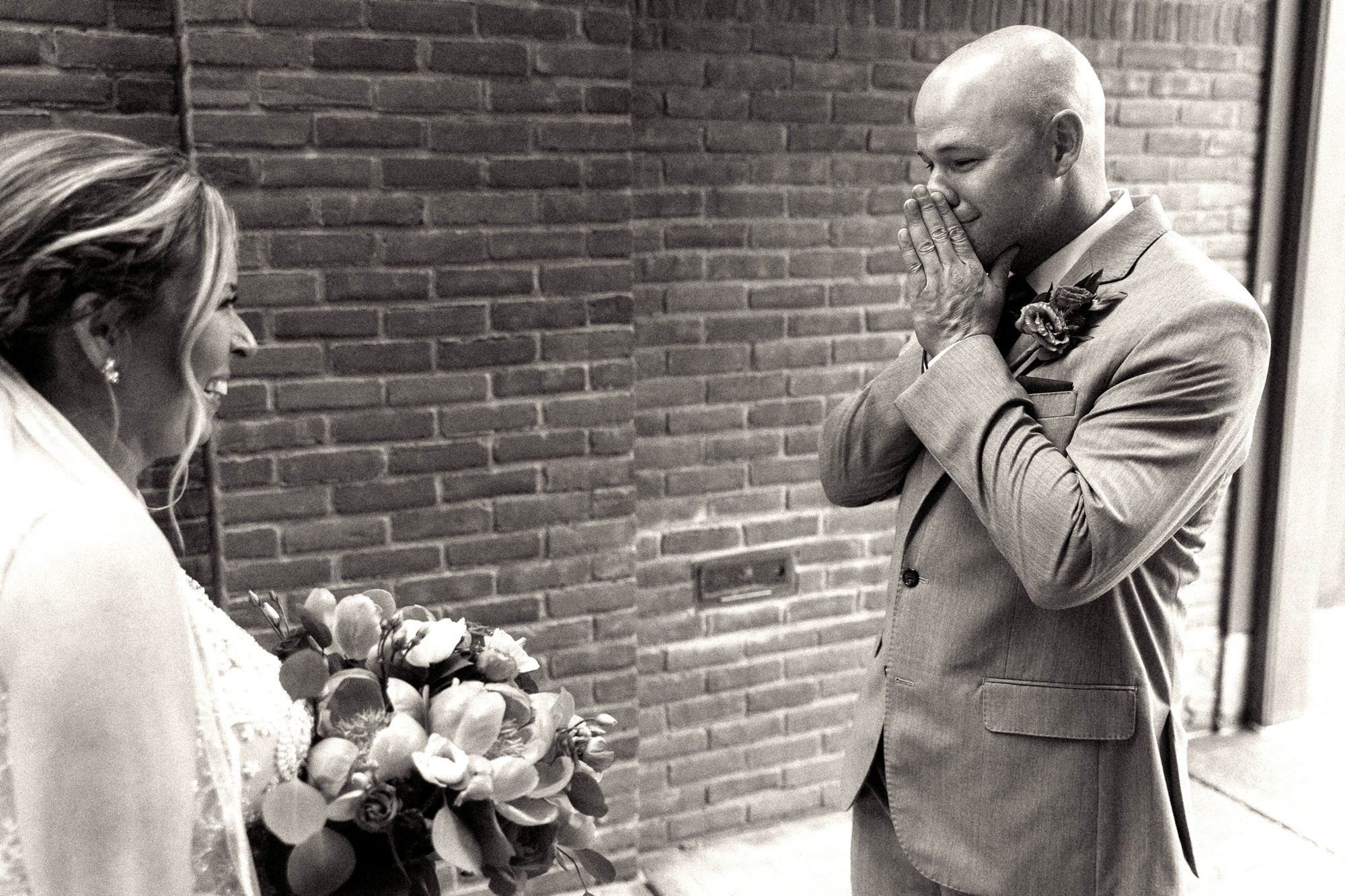groom crying during first look