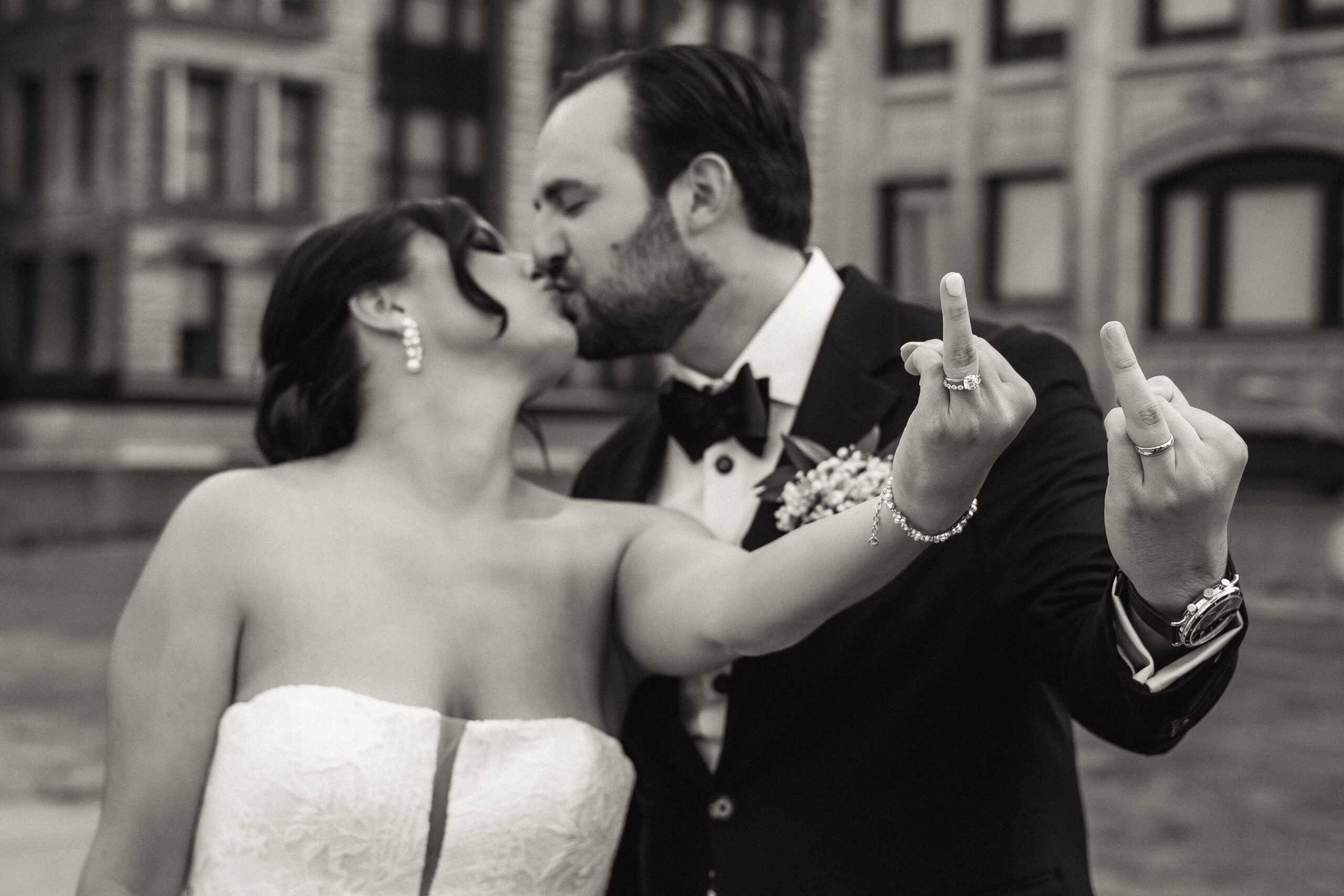 Bride and Groom Showing off Wedding Rings Detroit
