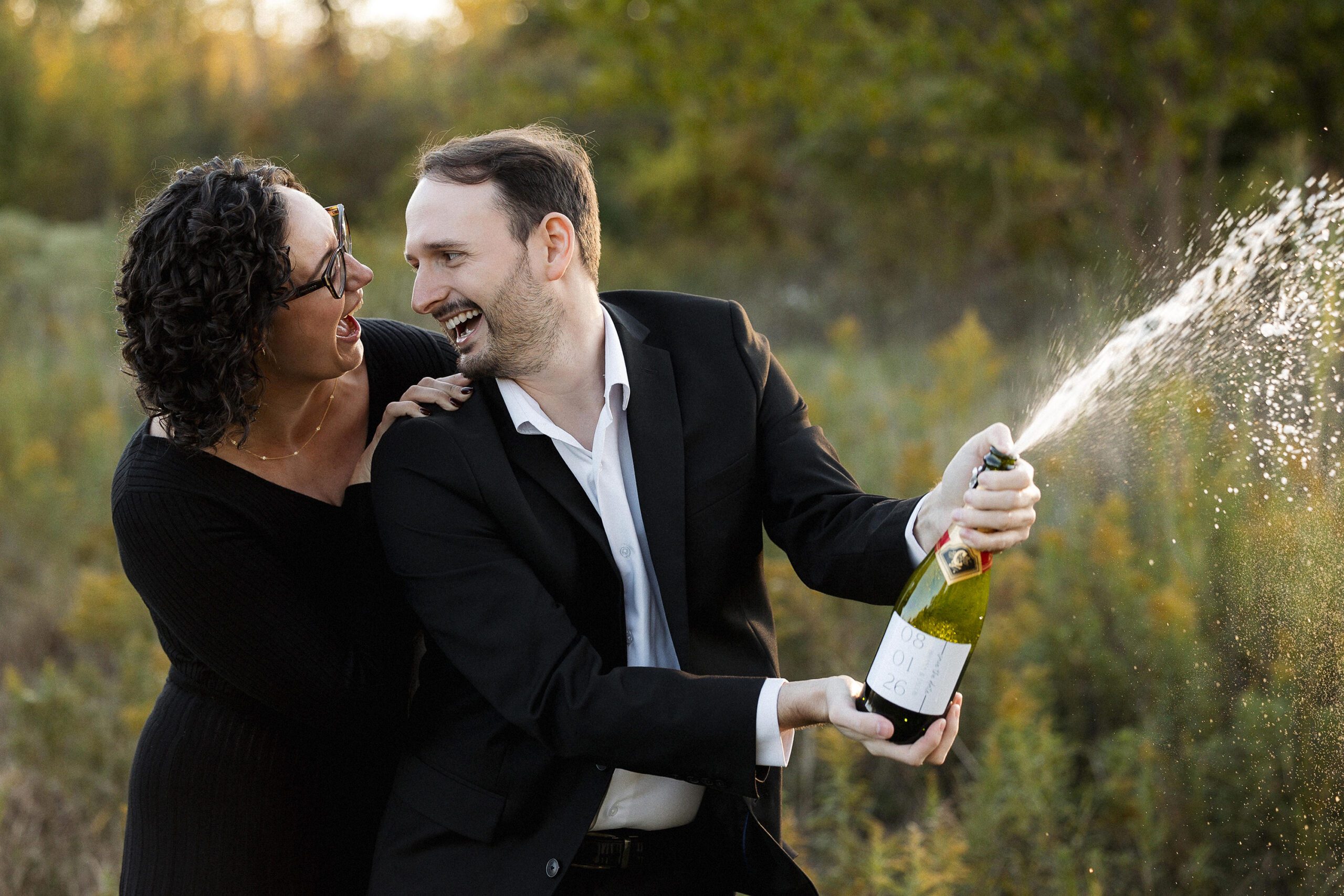 Couple laughing together during a Belle Isle engagement session