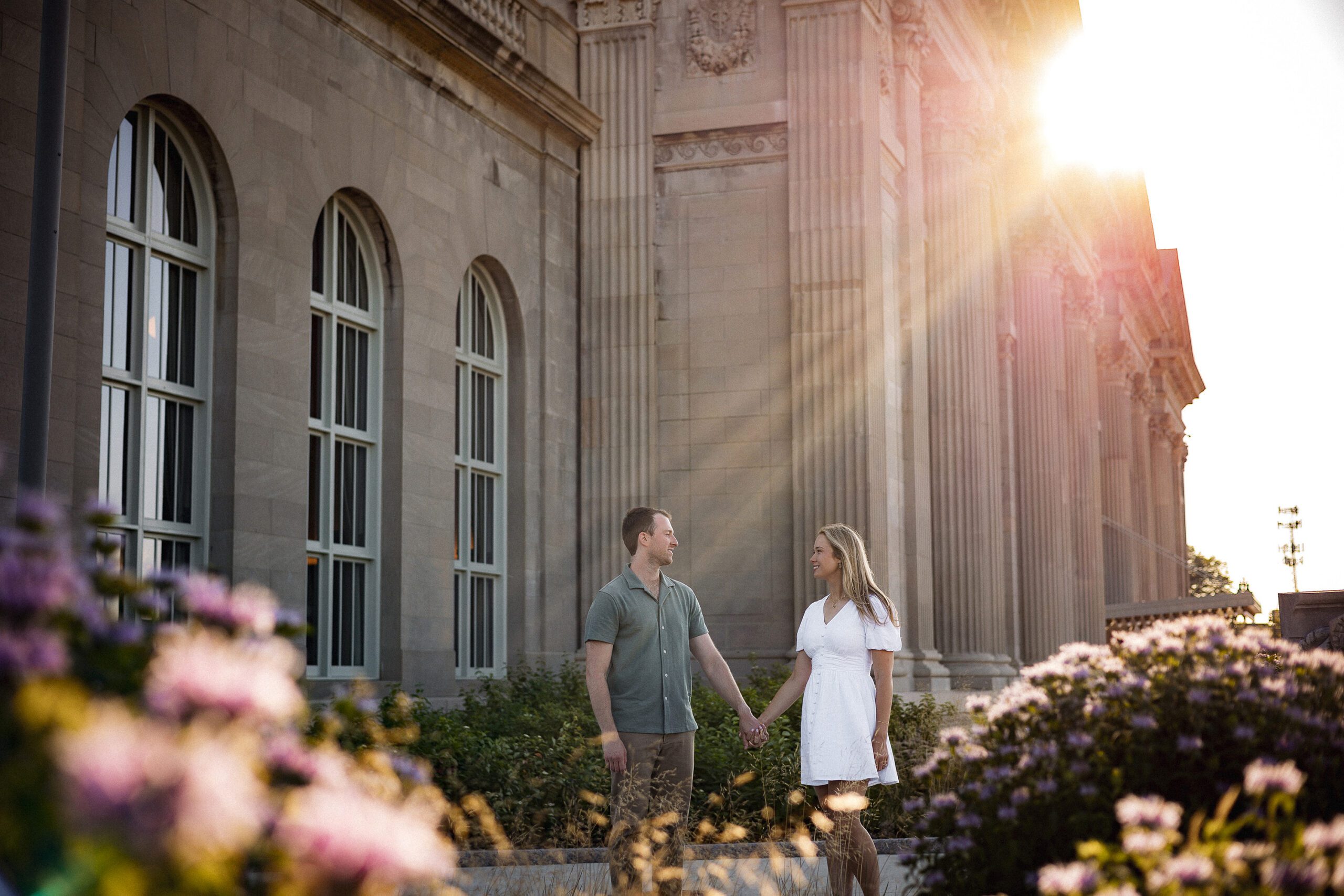 Couple holding hands during an engagement session at Michigan Central in Detroit