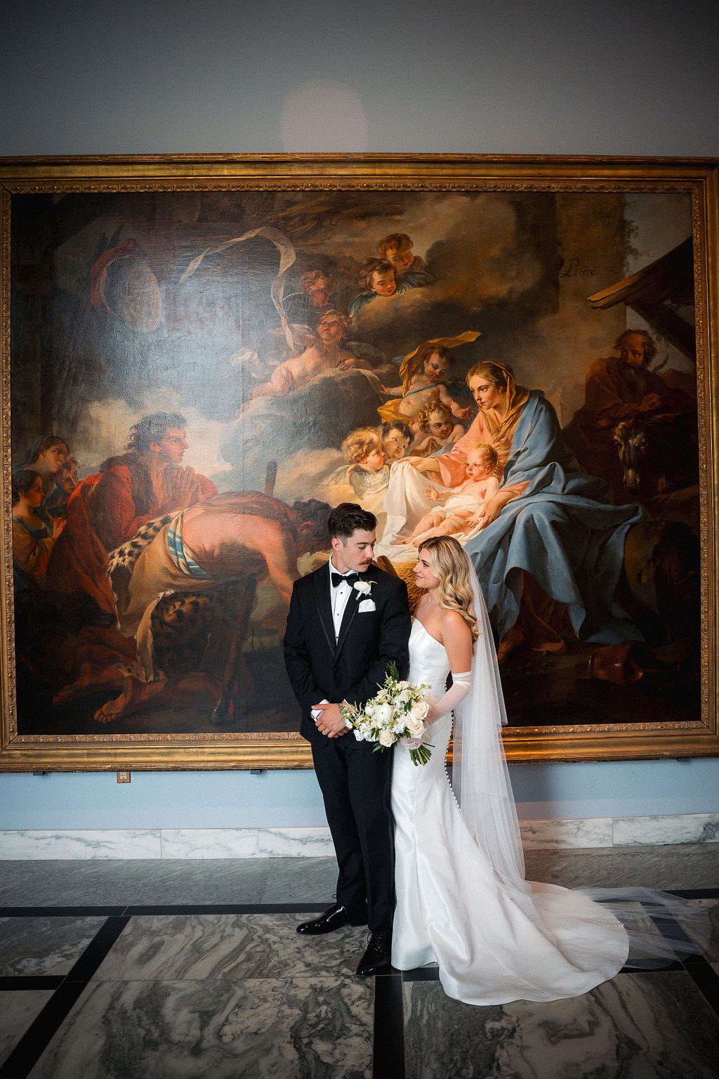 Bride and Groom Embrace in Gallery at DIA after Ceremony
