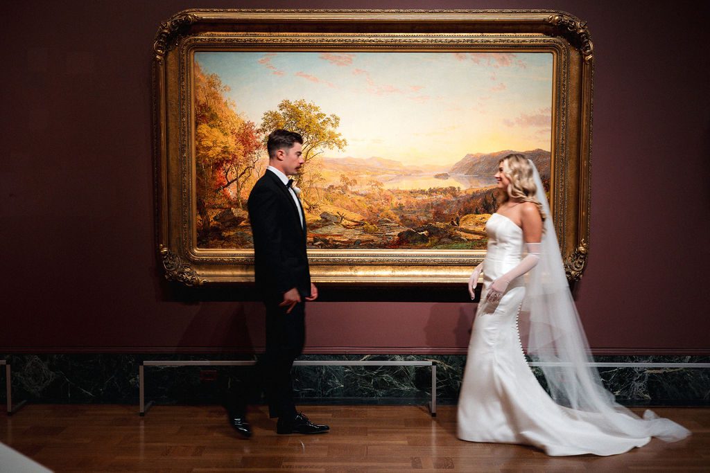 Bride and Groom Sharing First Look in Gallery at DIA Wedding