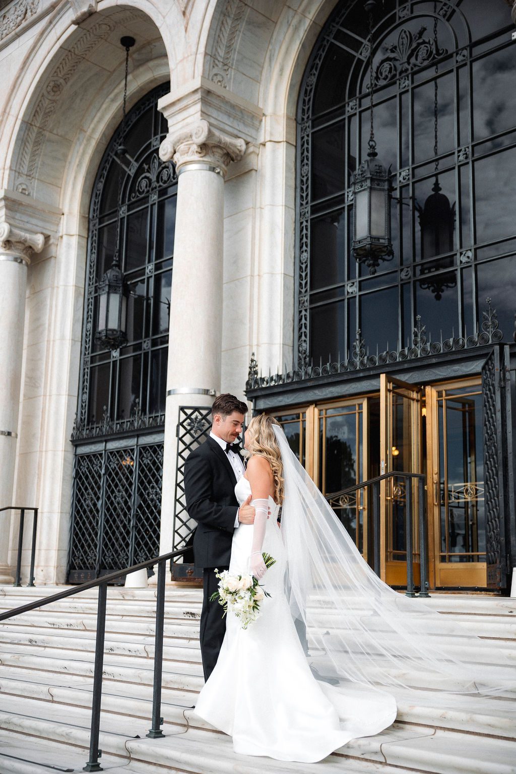 Bride and Groom on Marble Staircase at DIA