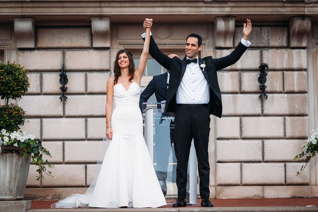 Bride and Groom Celebrate After Outdoor Wedding Ceremony