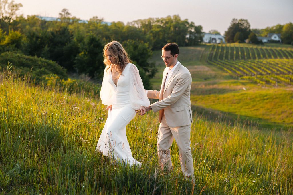 Bride and Groom Walking Through Winery at Sunset