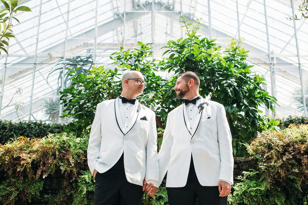 Grooms Pose for Wedding Photos at Greenhouse at Matthaei Botanical Gardens