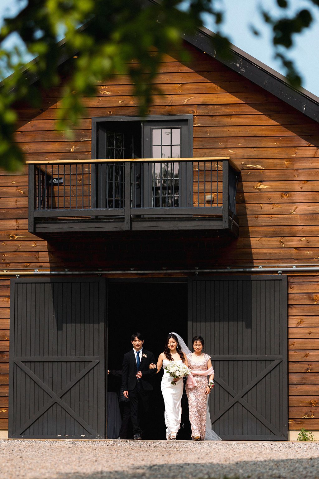 Bride Walking Down Aisle with Both Parents at Robin Hills Farm Wedding