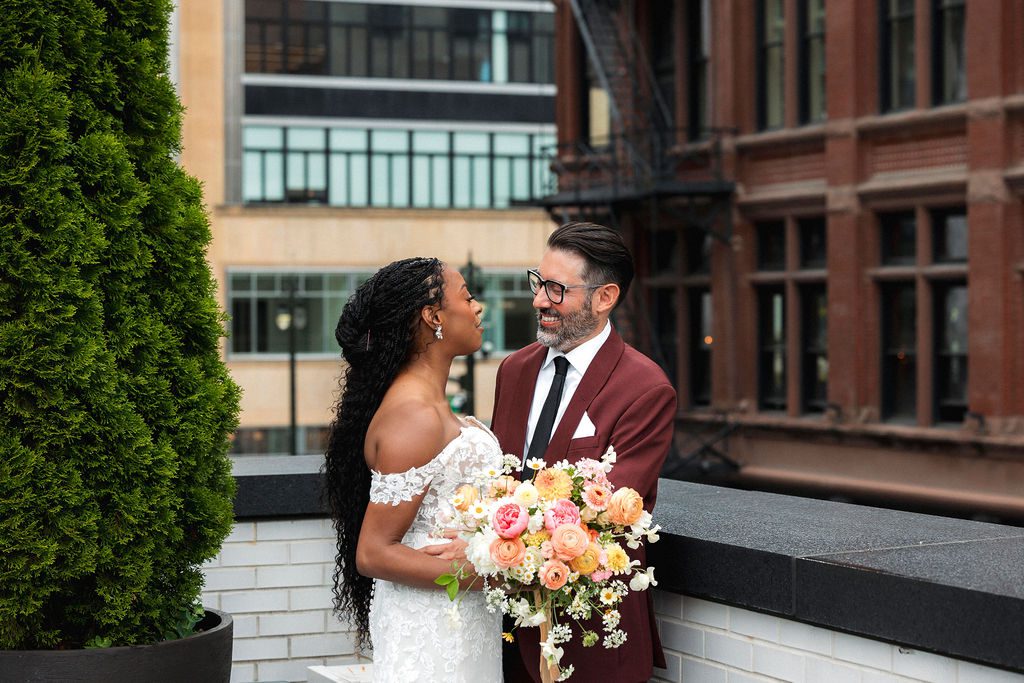 Bride and Groom Embrace on Rooftop at Shinola Hotel