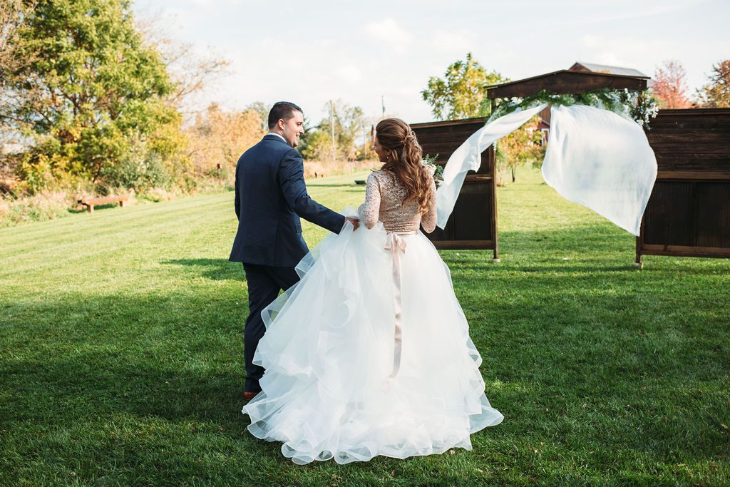 Bride and Groom Walk Down Aisle Together After Wedding Ceremony
