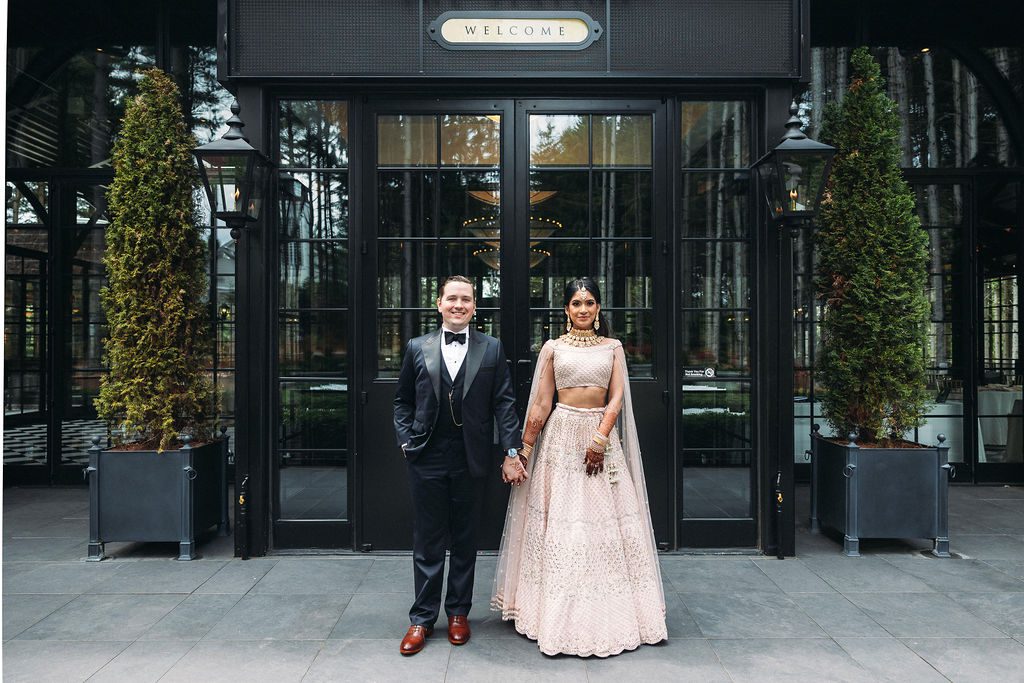 Bride and Groom Stand at Entrance to Shepherds Hollow Wedding Venue