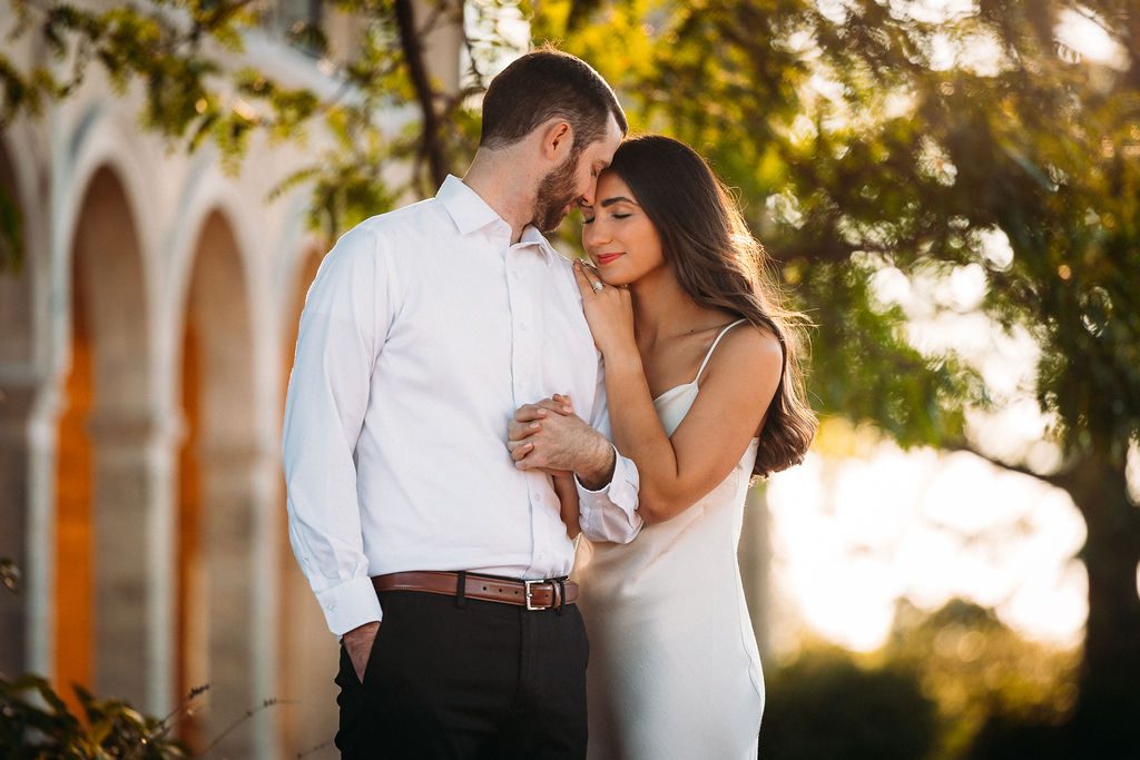 Couple Tenderly Embraces During Engagement Photoshoot