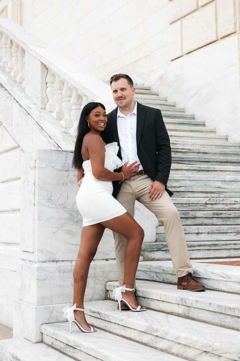 Fun and Chic Engagement Photos Outdoors on Marble Staircase