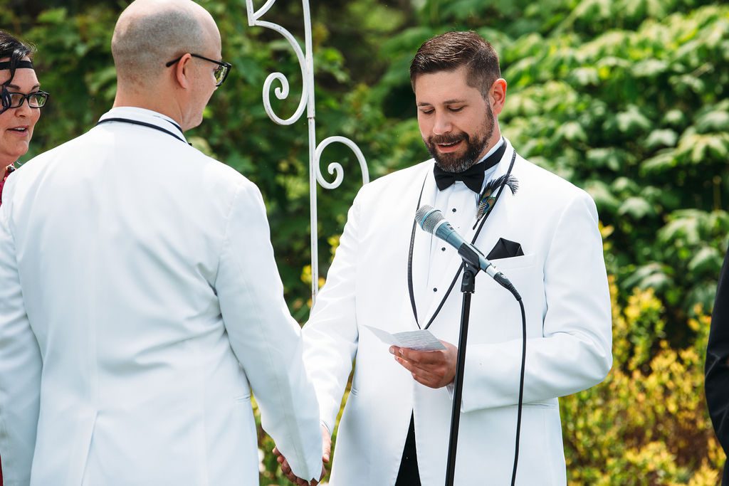 Grooms Hold Hands While Exchanging Wedding Vows